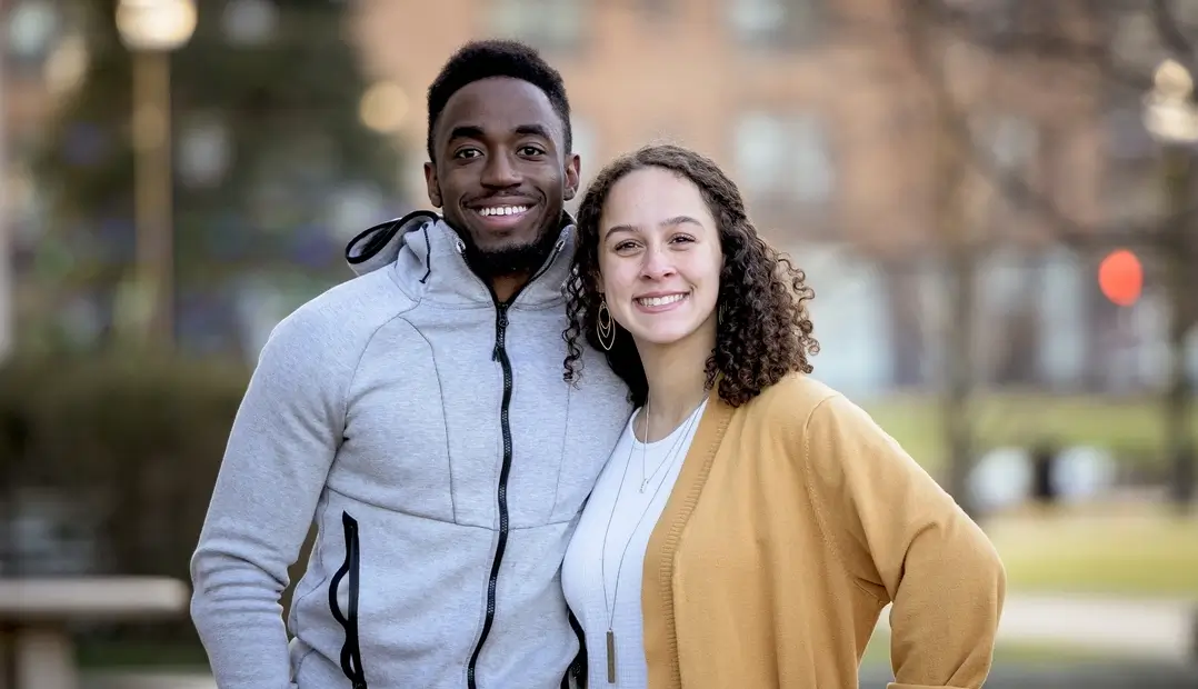 cute-selective-focus-shot-two-friends-smiling-posing-together (1) (1)
